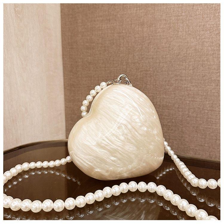 Heart-Shaped Pearl Shell Clutch Bag with Pearl Strap