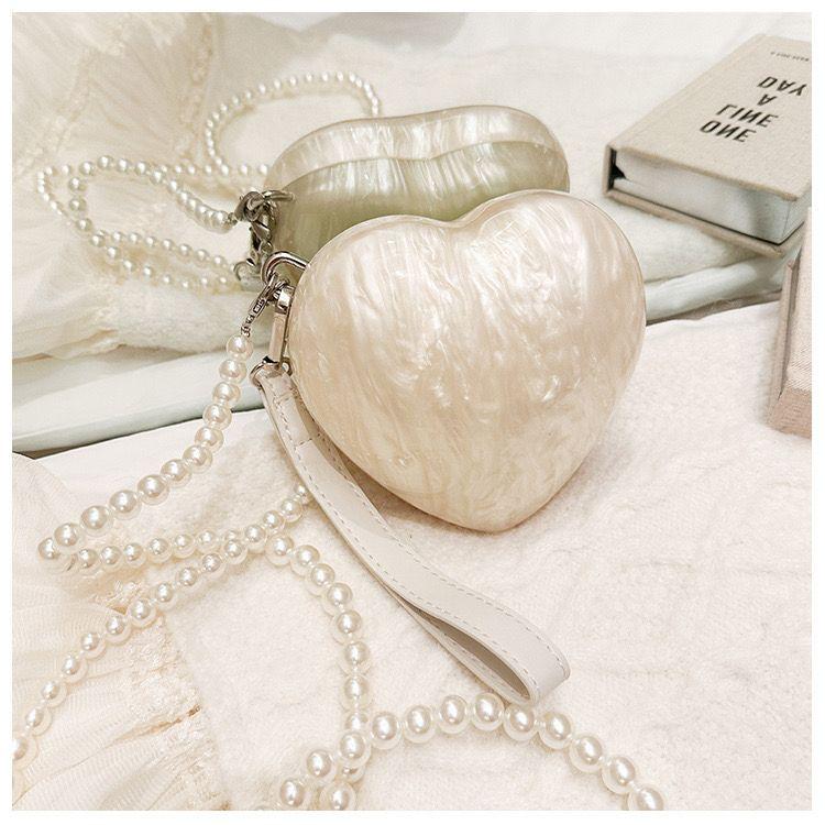 Heart-Shaped Pearl Shell Clutch Bag with Pearl Strap